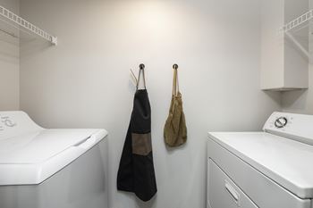 In unit laundry room with washer and dryer
